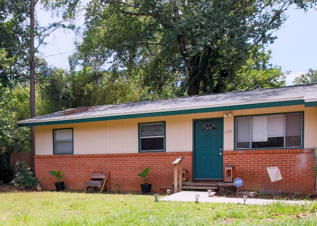 2105 Belle Vue Way, Tallahassee, FL 32304 - bungalow featuring brick siding, a front yard, and a shingled roof