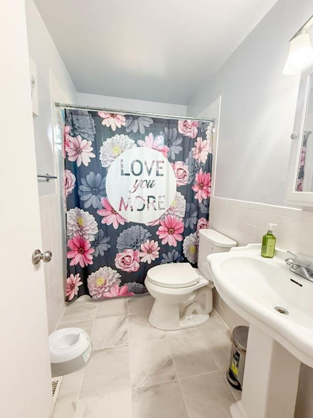 2105 Belle Vue Way, Tallahassee, FL 32304 - bathroom with toilet, tile walls, a shower with curtain, and a sink