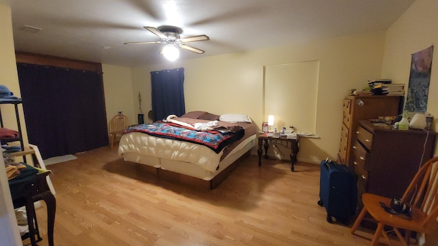 bedroom featuring ceiling fan and light wood-type flooring