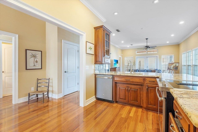 kitchen with sink, crown molding, stainless steel dishwasher, and light hardwood / wood-style floors