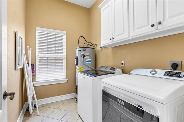 laundry room featuring cabinets, separate washer and dryer, electric water heater, and light tile patterned floors