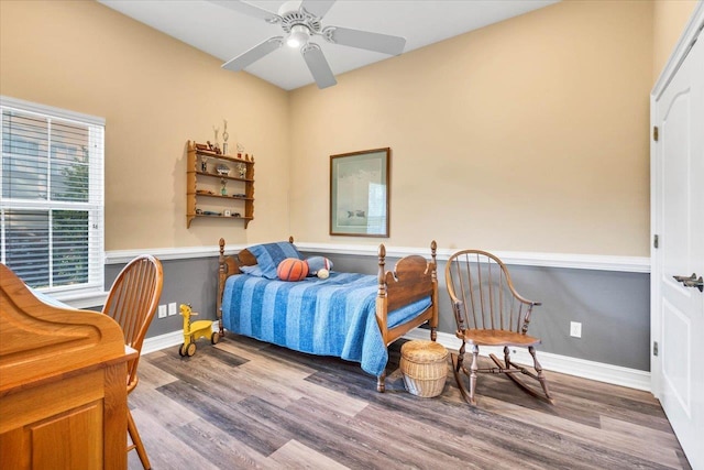 bedroom with wood-type flooring and ceiling fan