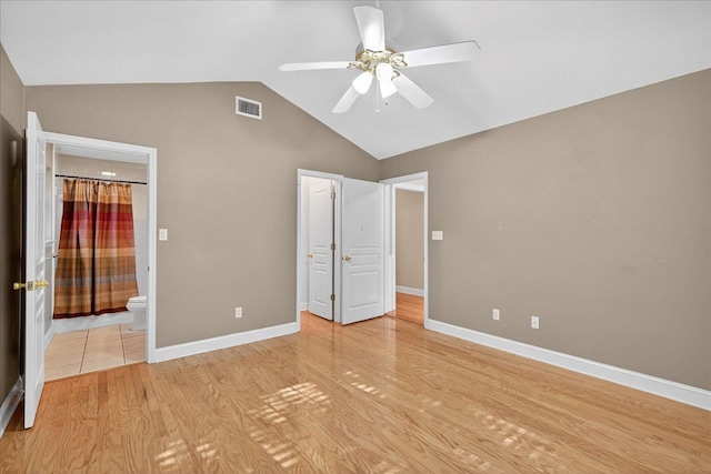 1913 Celtic Rd, Tallahassee, FL 32317 - unfurnished bedroom featuring light wood-type flooring, ensuite bathroom, baseboards, high vaulted ceiling, and ceiling fan
