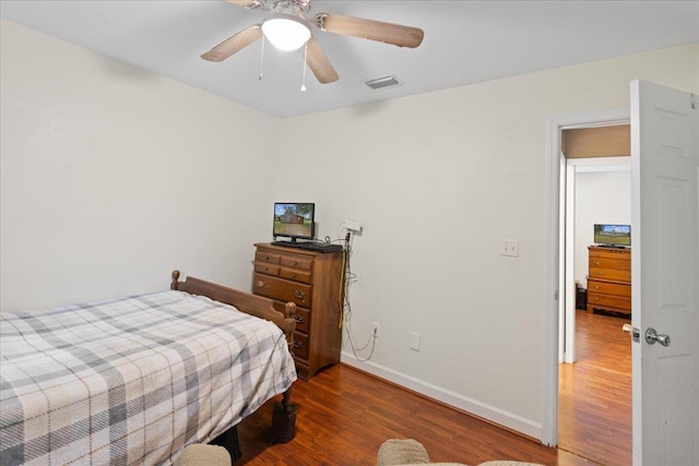 1439 W Lyman Hendry Rd, Perry, FL 32347 - bedroom with wood finished floors and ceiling fan