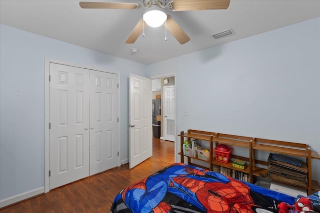 1439 W Lyman Hendry Rd, Perry, FL 32347 - bedroom with wood finished floors, ceiling fan, and a closet