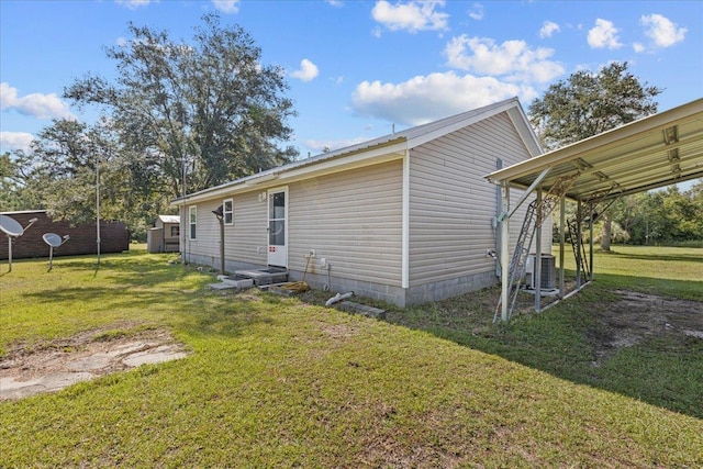 1439 W Lyman Hendry Rd, Perry, FL 32347 - view of side of property featuring a yard and a storage unit