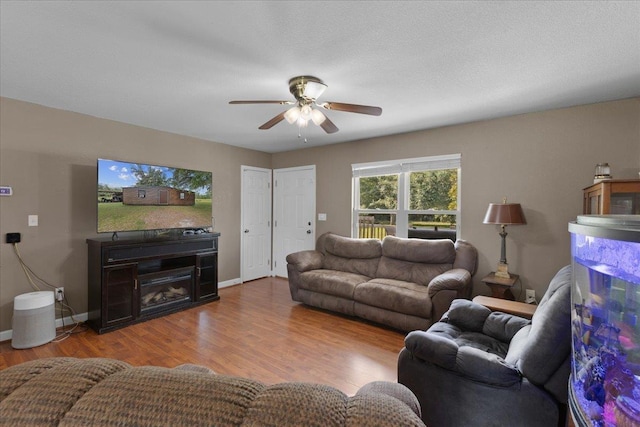 1439 W Lyman Hendry Rd, Perry, FL 32347 - living area with a ceiling fan and wood finished floors