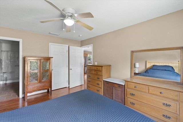 1439 W Lyman Hendry Rd, Perry, FL 32347 - bedroom with wood finished floors and ceiling fan