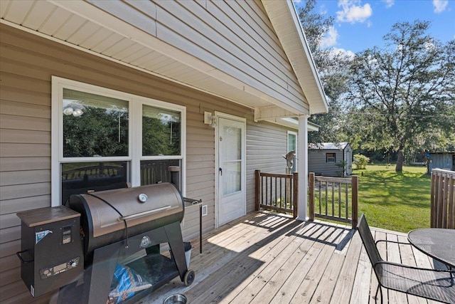 1439 W Lyman Hendry Rd, Perry, FL 32347 - wooden terrace with a yard, grilling area, and a shed
