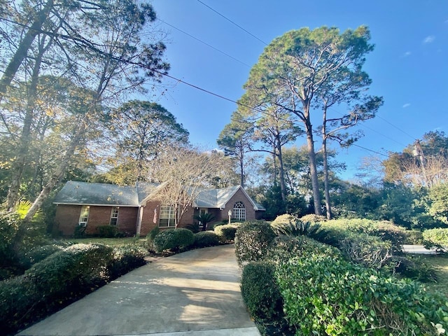 ranch-style house with brick siding