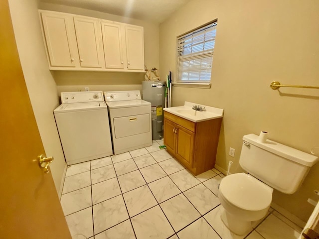 clothes washing area featuring laundry area, light tile patterned floors, washer and clothes dryer, water heater, and a sink