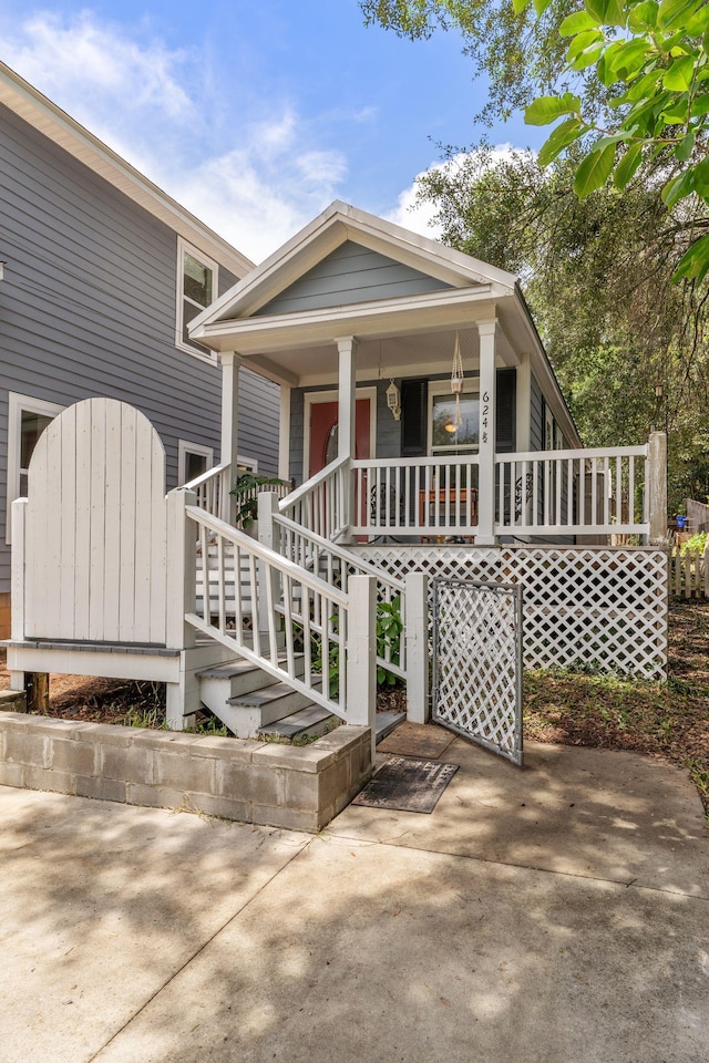 624 W 7th Ave, Tallahassee, FL 32303 - shotgun-style home featuring covered porch and stairs
