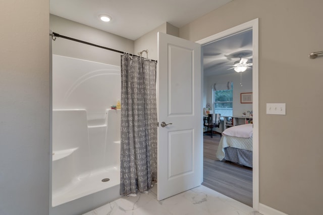 624 W 7th Ave, Tallahassee, FL 32303 - ensuite bathroom with curtained shower, marble look tile flooring, and a ceiling fan