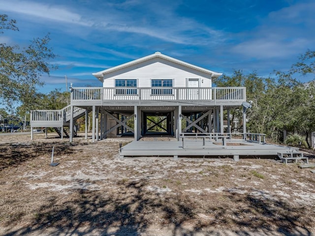 rear view of property featuring a deck