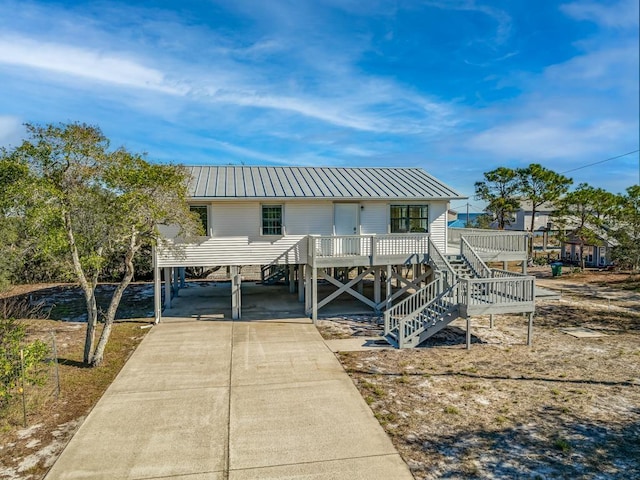 view of front of home with a carport