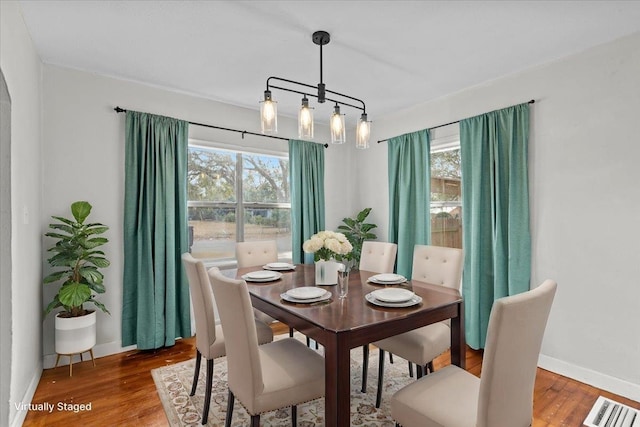 dining room featuring hardwood / wood-style flooring