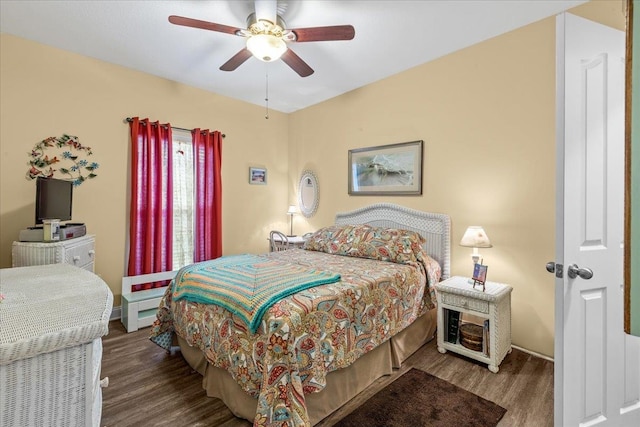 bedroom with hardwood / wood-style flooring and ceiling fan