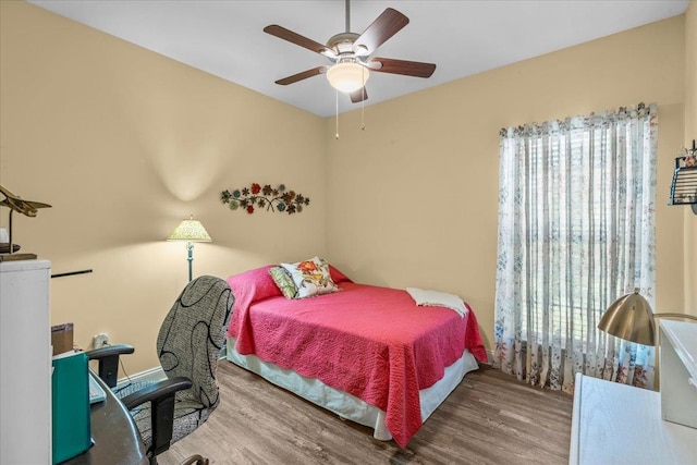 bedroom featuring ceiling fan and wood-type flooring