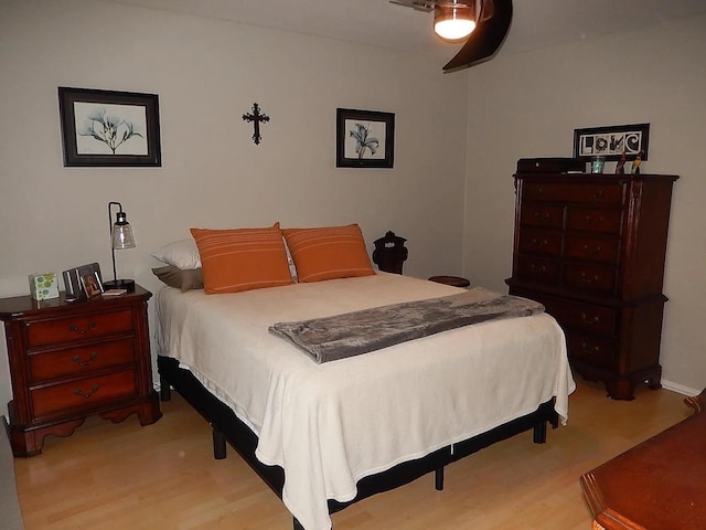 bedroom featuring light hardwood / wood-style flooring and ceiling fan