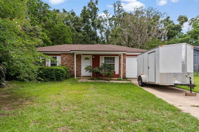 2090 Little River Ln, Tallahassee, FL 32311 - view of front of property featuring brick siding, a front yard, and roof with shingles