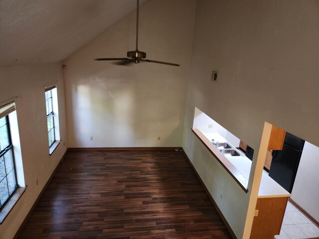 755 Gold Nugget Trl, Tallahassee, FL 32304 - unfurnished living room featuring high vaulted ceiling, wood finished floors, and a ceiling fan