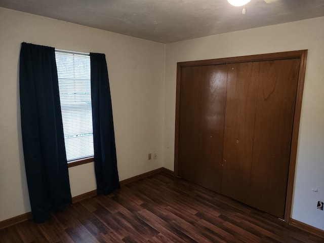 755 Gold Nugget Trl, Tallahassee, FL 32304 - unfurnished bedroom with dark wood-style flooring and a closet