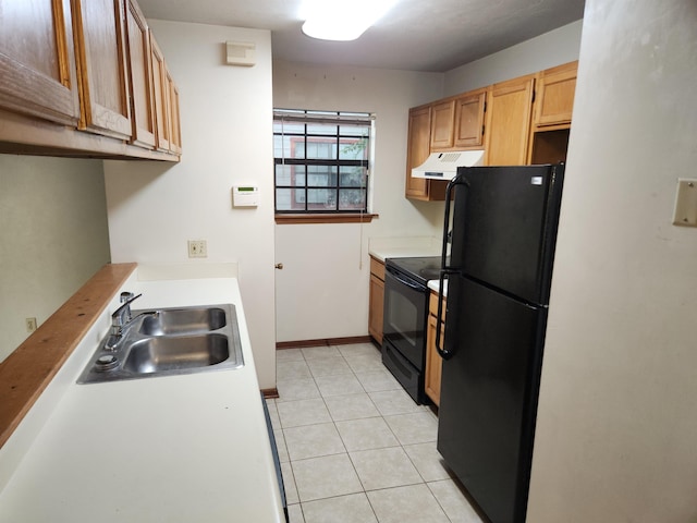 755 Gold Nugget Trl, Tallahassee, FL 32304 - kitchen with black appliances, under cabinet range hood, light countertops, and light tile patterned flooring