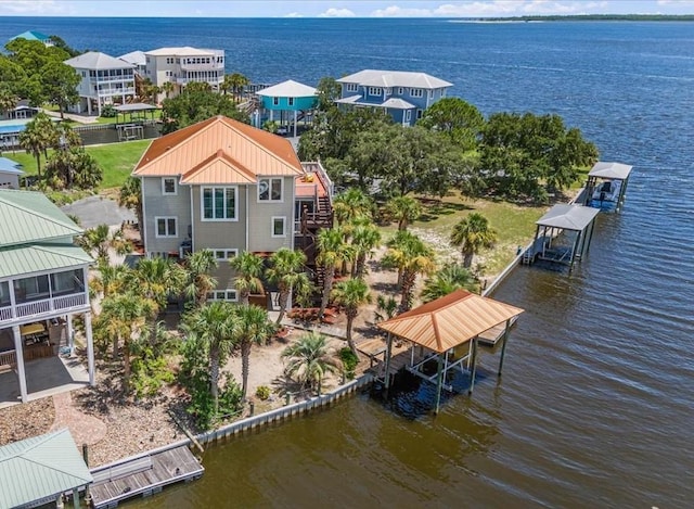 birds eye view of property featuring a water view