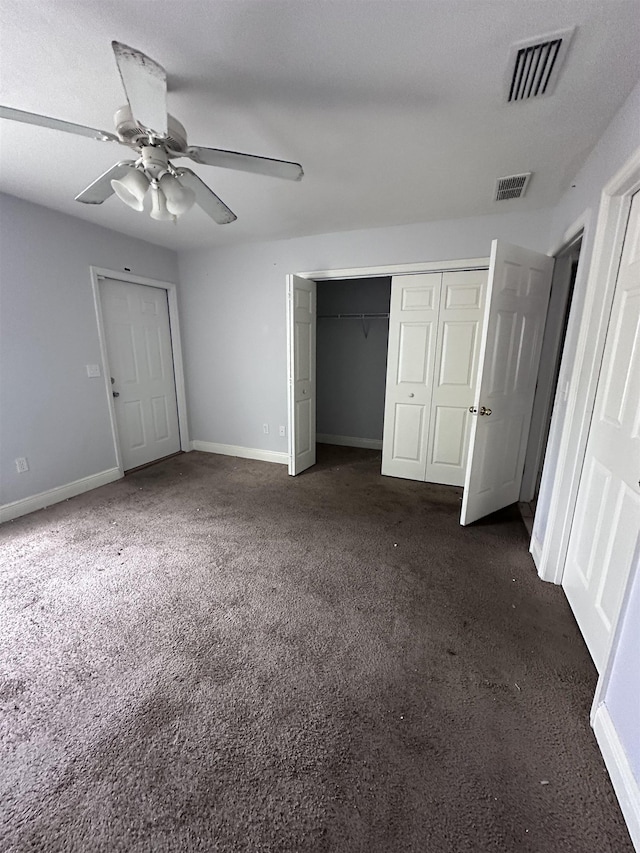 3340 Sugar Berry Way, Tallahassee, FL 32303 - unfurnished bedroom featuring dark colored carpet, a closet, and ceiling fan