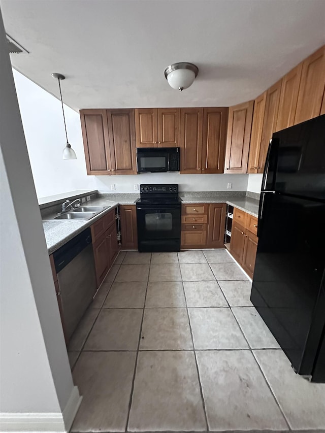 3340 Sugar Berry Way, Tallahassee, FL 32303 - kitchen with black appliances, light tile patterned floors, light countertops, brown cabinets, and decorative light fixtures
