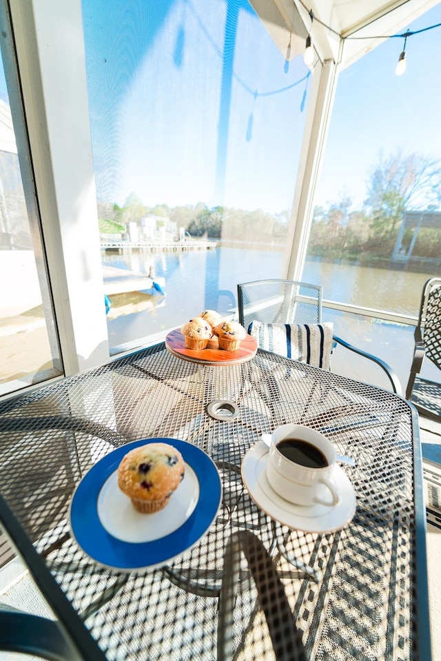 balcony featuring a water view