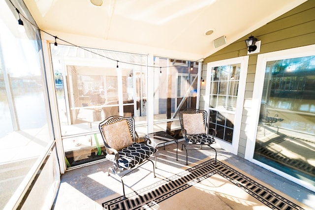 sunroom / solarium with lofted ceiling