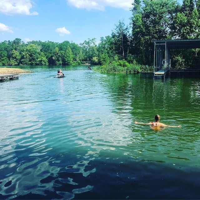 property view of water featuring a boat dock