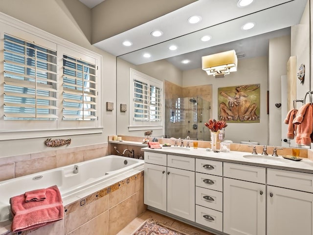 45 Walker Creek Dr, Shell Point, FL 32327 - bathroom featuring a stall shower, double vanity, a garden tub, recessed lighting, and tile patterned floors