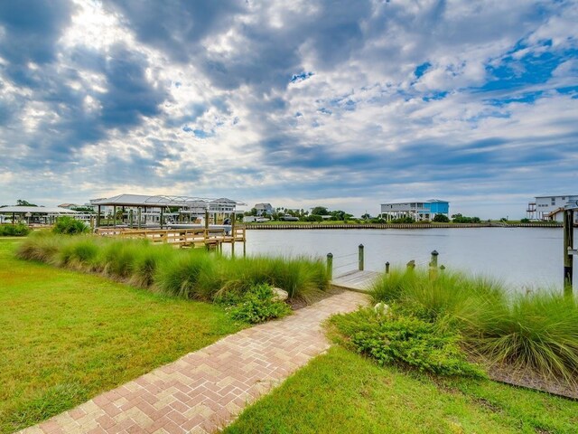 45 Walker Creek Dr, Shell Point, FL 32327 - dock with a water view, boat lift, and a yard