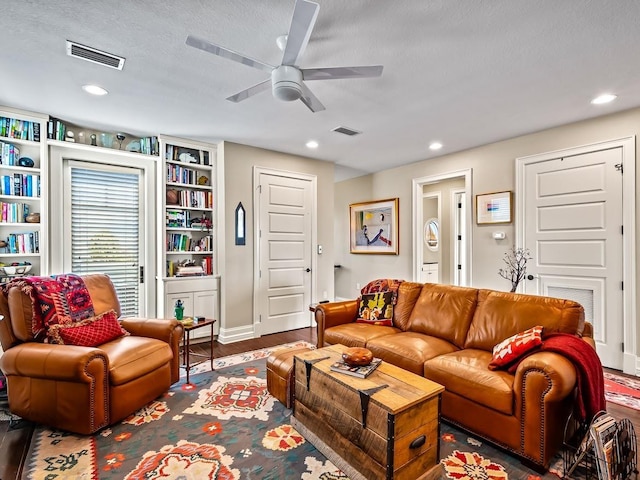 45 Walker Creek Dr, Shell Point, FL 32327 - living room with ceiling fan, wood finished floors, recessed lighting, built in features, and a textured ceiling