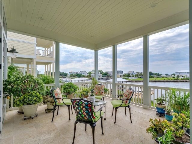 45 Walker Creek Dr, Shell Point, FL 32327 - sunroom featuring a water view and stone finish flooring