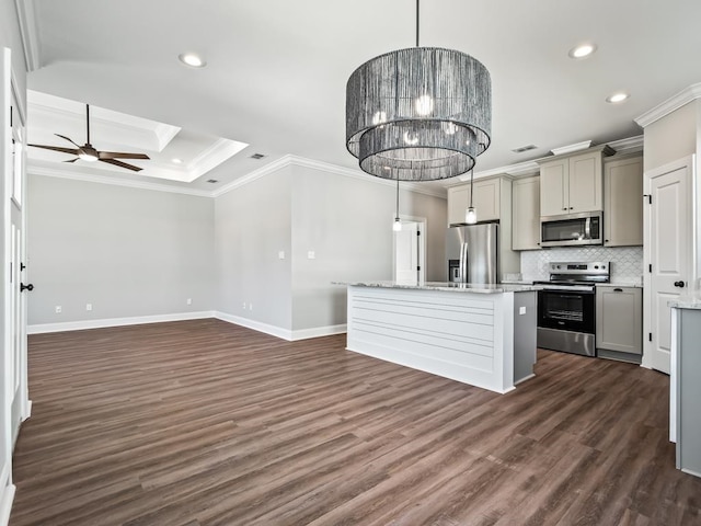 kitchen with dark hardwood / wood-style flooring, light stone counters, gray cabinetry, pendant lighting, and appliances with stainless steel finishes