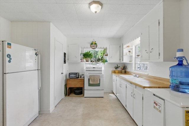 2743 US-19 Hwy, Perry, FL 32347 - kitchen featuring white appliances, light countertops, and white cabinetry