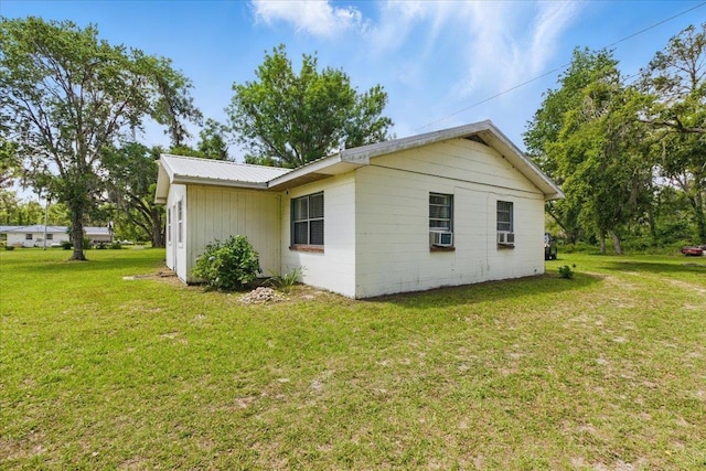 2743 US-19 Hwy, Perry, FL 32347 - view of side of property featuring a lawn and metal roof