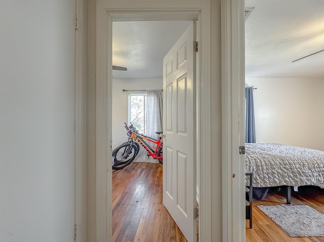 hallway with wood finished floors