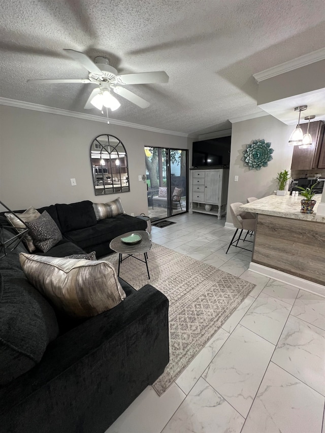 living room featuring a textured ceiling, ceiling fan, and crown molding