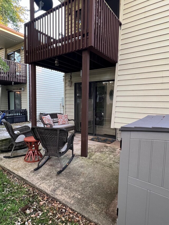 view of patio / terrace featuring a wooden deck and an outdoor living space