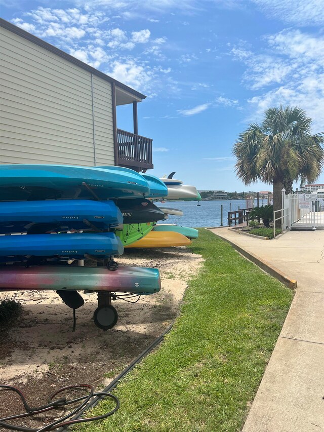 view of yard with a water view and a balcony