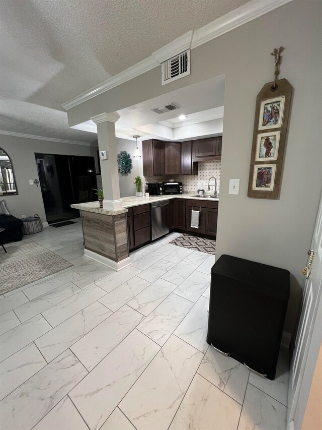 kitchen with dark brown cabinetry, a textured ceiling, backsplash, and crown molding