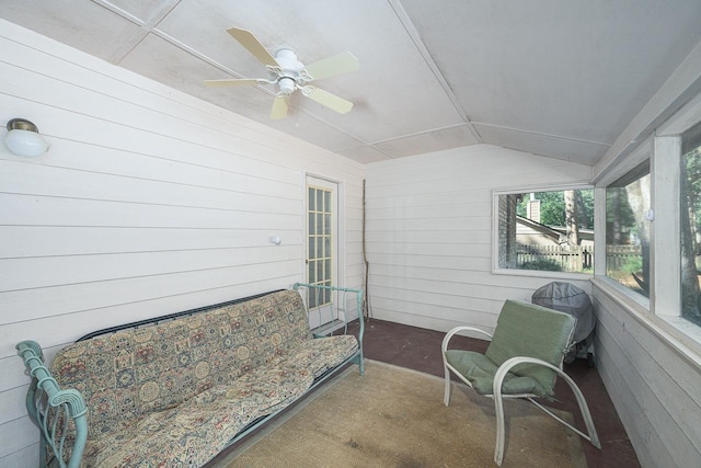 sunroom featuring ceiling fan and vaulted ceiling