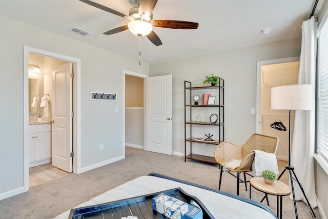1942 Evanston Ave Unit 506, Tallahassee, FL 32304 - bedroom with light carpet, baseboards, ensuite bathroom, and ceiling fan