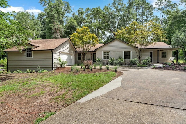 3744 Lifford Cir, Tallahassee, FL 32309 - ranch-style house with an attached garage, roof with shingles, and concrete driveway