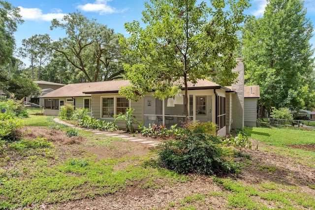 3744 Lifford Cir, Tallahassee, FL 32309 - rear view of property with a sunroom