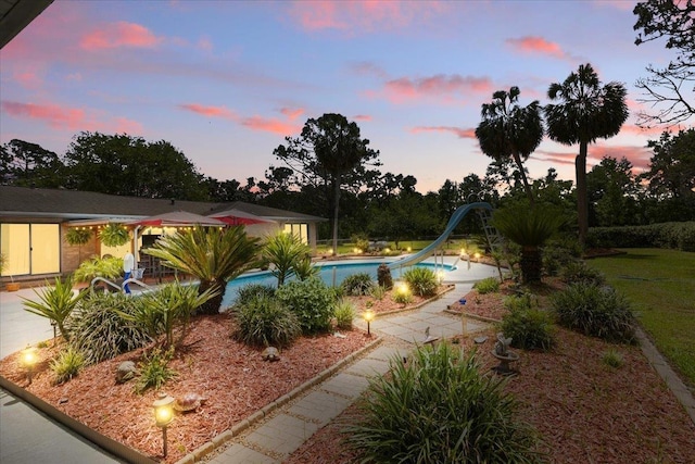 1775 N US-19 Hwy, Perry, FL 32347 - exterior space with a water slide, a patio area, and an outdoor pool